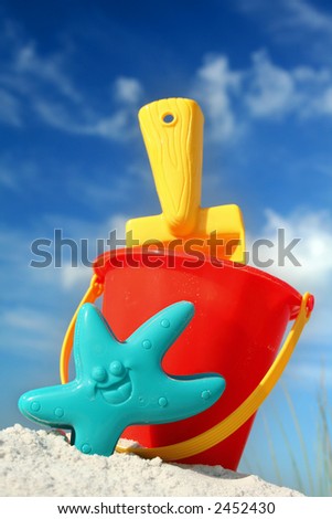 stock photo : Bucket and spade on tropical beach with blue sky