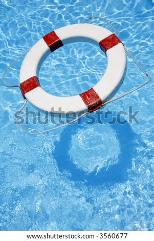 Safety lifebelt floating in bright blue water