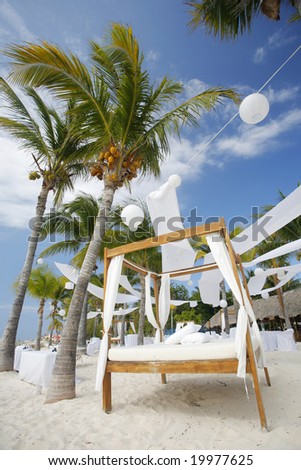 stock photo Tables and Bed set up for a beach wedding on a tropical 
