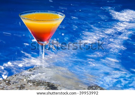 Refreshing sex on the Beach cocktail with big water splash