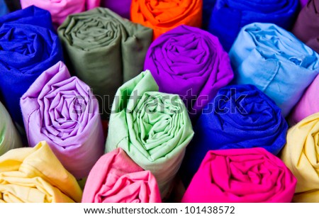 Colorful silk rolled and keep in the basket