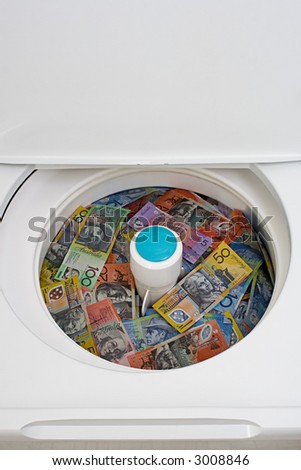 Washing machine filled to the top with Australian money