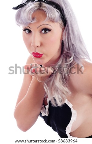 stock photo Pretty Pin Up Model blowing a kiss and posed as a housewife