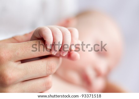Newborn baby 6 weeks old. Close up of hand and fingers.