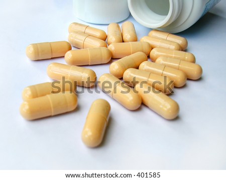 A Pile Of Pills (Capsules) And An Opened Flack - Pharmacy And Health
