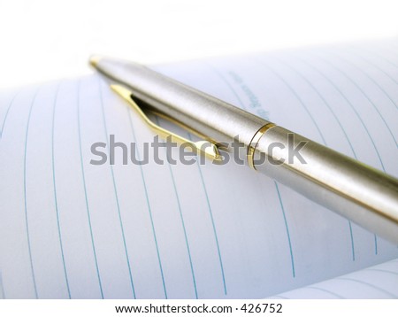 Business Pen On A Note-Book