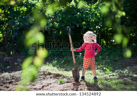 small girl helps to dig small girl helps to dig