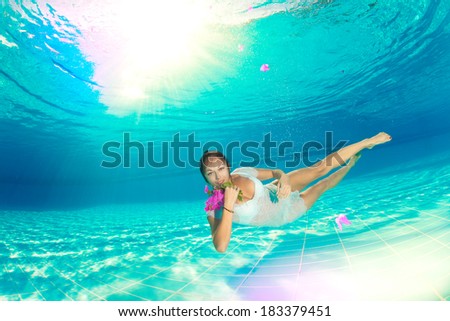 underwater swimming with flowers