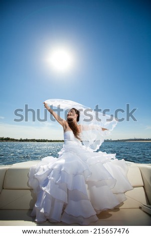 bride with veil in the boat