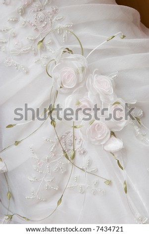 stock photo white wedding dress with green leaf