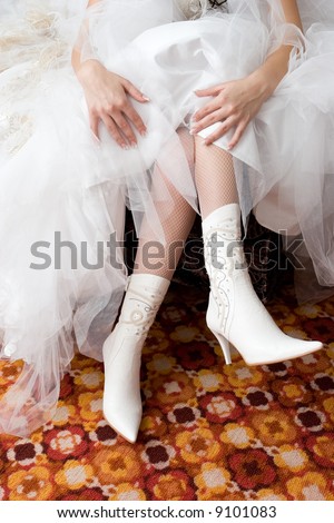 stock photo hands of the girl in a white wedding dress put on the white