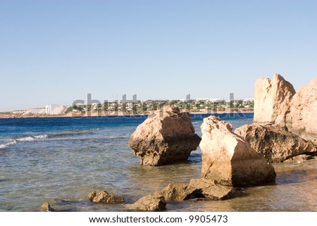 a view to the hotel line of the Red Sea through the rocks and sea