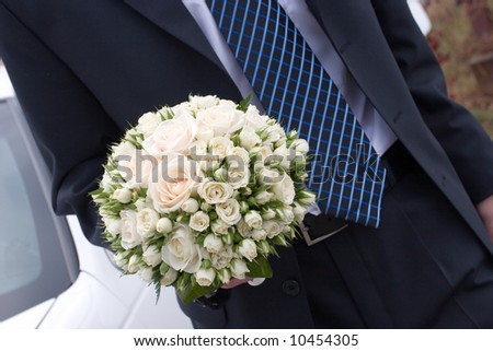 rose bouquet in the hand of a man