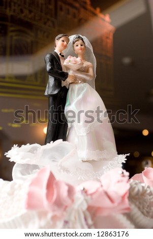 stock photo figurines of bride and groom on a wedding cake