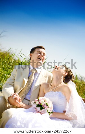 laughing bride and groom outdoors