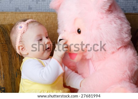 small girl with big toy bear