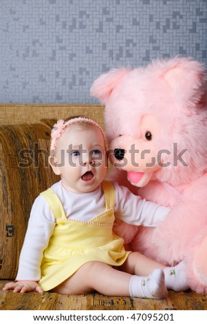 small girl with big toy bear