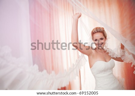 bride playing with flying veil
