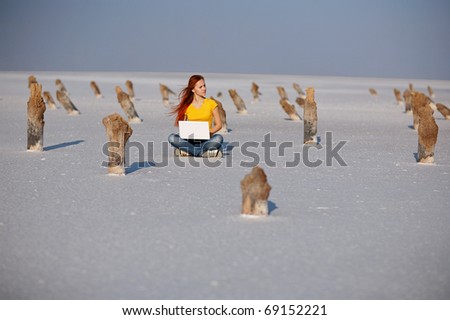 girl with notebook on the salt sand