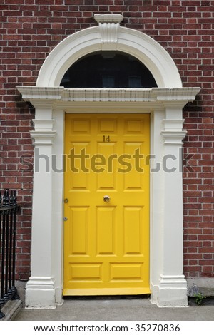 Yellow front door in urban street
