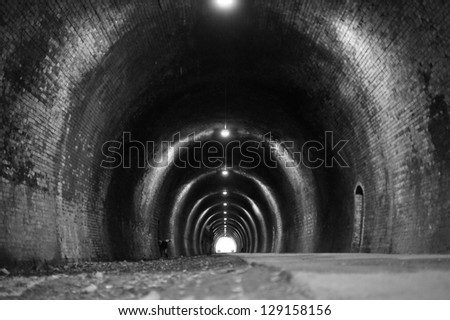 Black and white tunnel with lighting