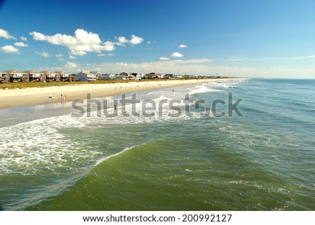 Views of the Holden\'s Beach in NC with ocean front properties in the background
