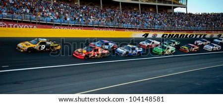 CHARLOTTE, NC - MAY 27:  Marcos Ambrose leads the field  at the Nascar Coca Cola 600  at Charlotte Motorspeedway in Charlotte, NC on May 27, 2012