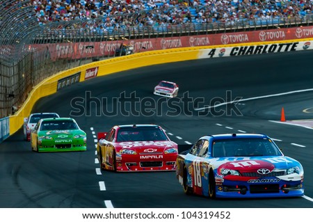 CHARLOTTE, NC - MAY 27: Kyle Busch leads Tony Stewart and Kasey Kahne at the Nascar Coca Cola 600 at Charlotte Motorspeedway in Charlotte, NC on May 27, 2012