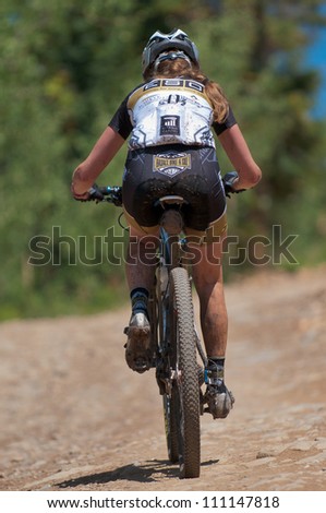 ASPEN, CO - AUG 25: Rachel Hadley uphill at The Power of Four mountain bike race in Aspen, CO on Aug 25, 2012