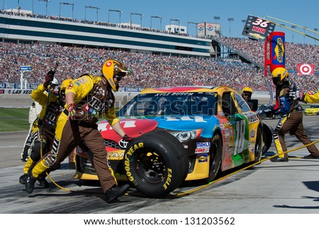 LAS VEGAS MAR 10 Kyle Busch in for a pit stop at the Nascar Kobalt 400 in Las Vegas NV on Mar 10 2013 LAS VEGAS MAR 10 Kyle Busch in for a pit stop at the Nascar Kobalt 400 in Las Vegas NV on Mar 10 2013