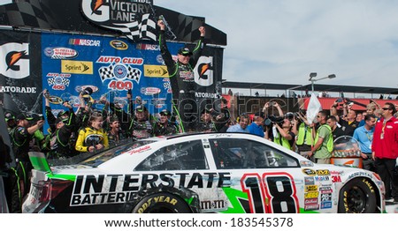 FONTANA, CA - MAR 23:Kyle Busch celebrates the win at the Nascar Sprint Cup Auto Club 400 race at Auto Club Speedway in Fontana, CA on March 23, 2014