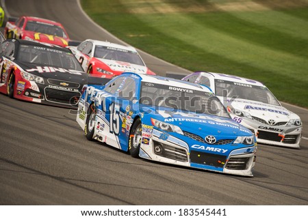 FONTANA, CA - MAR 23: Clint Bowyer leads the restart at the Nascar Sprint Cup Auto Club 400 race at Auto Club Speedway in Fontana, CA on March 23, 2014