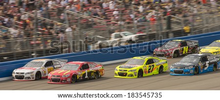FONTANA, CA - MAR 23: Dale Earnhardt Jr (88) and Jamie McMurray leading the chasers at the Nascar Sprint Cup Auto Club 400 race at Auto Club Speedway in Fontana, CA on March 23, 2014