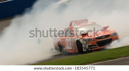 FONTANA, CA - MAR 23: Brian Scott crashes at the Nascar Sprint Cup Auto Club 400 race at Auto Club Speedway in Fontana, CA on March 23, 2014