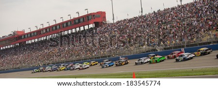 FONTANA, CA - MAR 23: Restart in front of the crowd at the Nascar Sprint Cup Auto Club 400 race at Auto Club Speedway in Fontana, CA on March 23, 2014