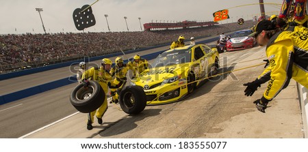 FONTANA, CA - MAR 23: Pit stop and tire changeing for Matt Kenseth at the Nascar Sprint Cup Auto Club 400 race at Auto Club Speedway in Fontana, CA on March 23, 2014