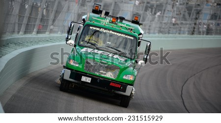 MIAMI, FL - Nov 16: Sweeper truck at the Nascar Sprint Cup Ford Ecoboost 400 race at Homestead-Miami Raceway in Homestead, FL on November 16, 2014
