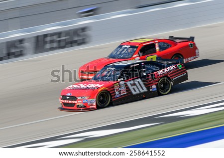 LAS VEGAS, NV - March 07: Chris Buescher passes competitor at the NASCAR Boyd Gaming 300 Xfinity race at Las Vegas Motor Speedway in Las Vegas, NV on March 07, 2015