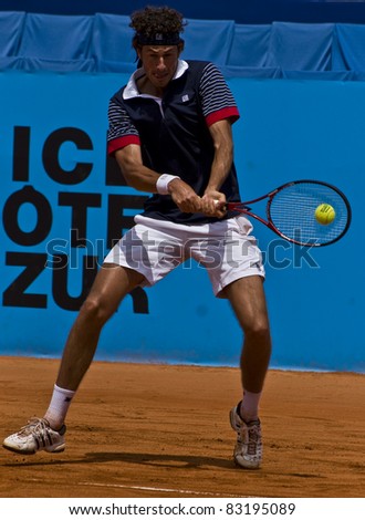 NICE, FRANCE - MAY 15: Dutch tennis player Robin Haase hits a backhand ball in a tennis match during the 2011 ATP Nice Cote d\'Azur Open tennis tournament on May 15, 2011 in Nice, France