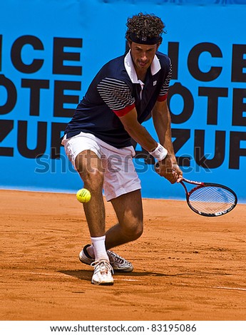 NICE, FRANCE - MAY 15: Dutch tennis player Robin Haase hits a backhand ball in an early round tennis match during the 2011 ATP Nice Cote d\'Azur Open tennis tournament on May 15, 2011 in Nice, France