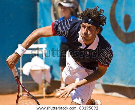 NICE, FRANCE - MAY 17: Dutch tennis player Robin Haase hits a serve in a tennis match during the 2011 ATP Nice Cote d\'Azur Open tennis tournament on May 17, 2011 in Nice, France