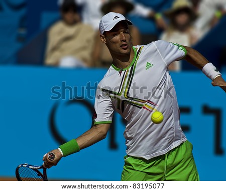 NICE, FRANCE - MAY 17:  Italian tennis player Fabio Fognini hits a forehand ball against latvian Ernests Gulbis at the 2011 ATP Nice Cote d\'Azur Open tennis tournament on May 17, 2011 in Nice, France