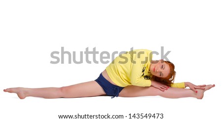 Pretty flexible dancer woman sit on twine and stretching isolated on white