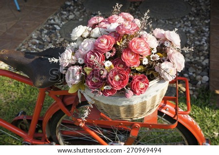 old bicycle with basket of flowers