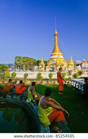 Monks and golden pagoda in Mae Hong Son province, Thailand
