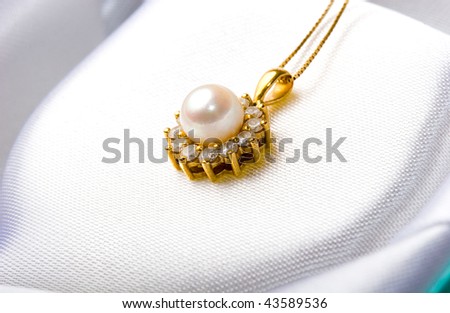 Elegant beautiful jewelry single pearl pendant with diamonds in gold setting inside a gift box