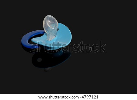 Pacifier over black