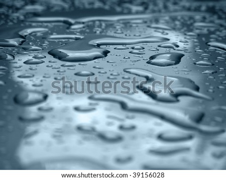 Water drops on a silver metallic car roof.