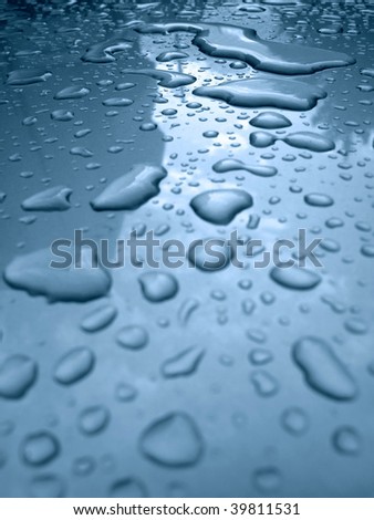 Water drops on a silver metallic car roof