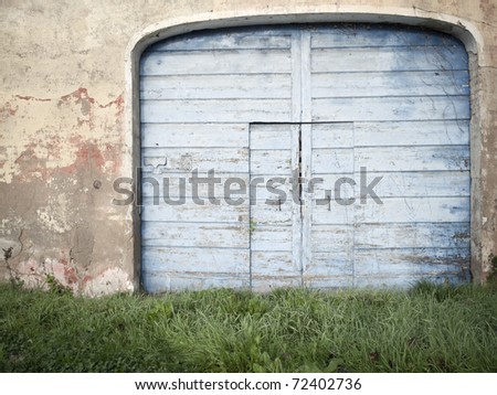 Old rural door in an abandoned ruin